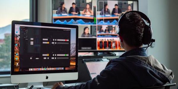 Journalism student works on computers