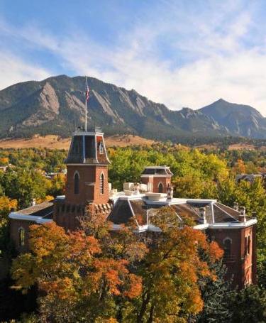 Old Main on the CU campus, with the Flatirons in the distance.